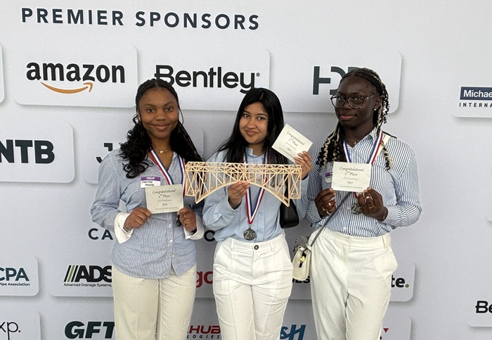 2026 Second Place winners from Team Mission Archers at Eleanor Roosevelt High School in Greenbelt, MD: Gabriella Mbakop, Wania Shabaz and Tanitoluwa Ojifinni.