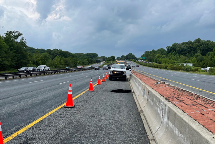 Surface view of area  on Eastbound US 50 needing repair due to a failed drainage pipe on the shoulder.