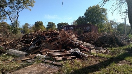 Photo of illegal roadside disposal of wood and rubbish.