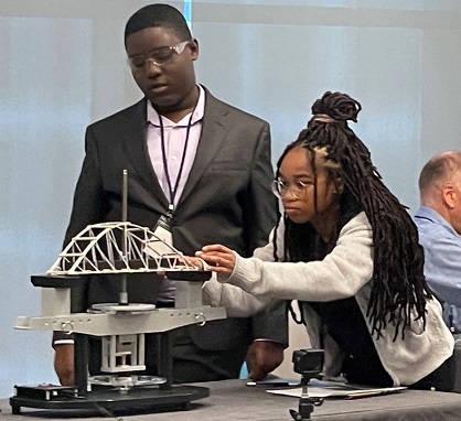 Cherry is 3” team members make final adjustments to their bridge at the national competition